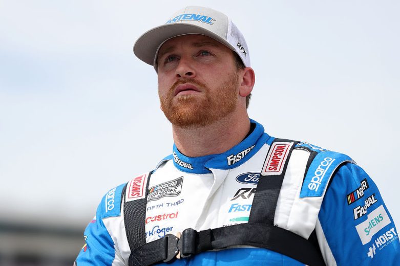 Chris Buescher looks on.