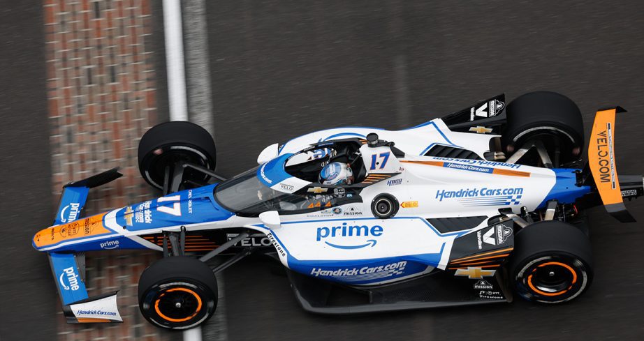 Kyle Larson's car crosses the yard of bricks at the Indianapolis Motor Speedway.