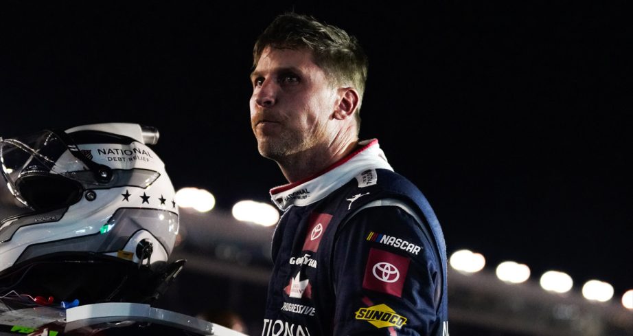 Denny Hamlin climbs from his car after the Coca-Cola 600 at Charlotte.