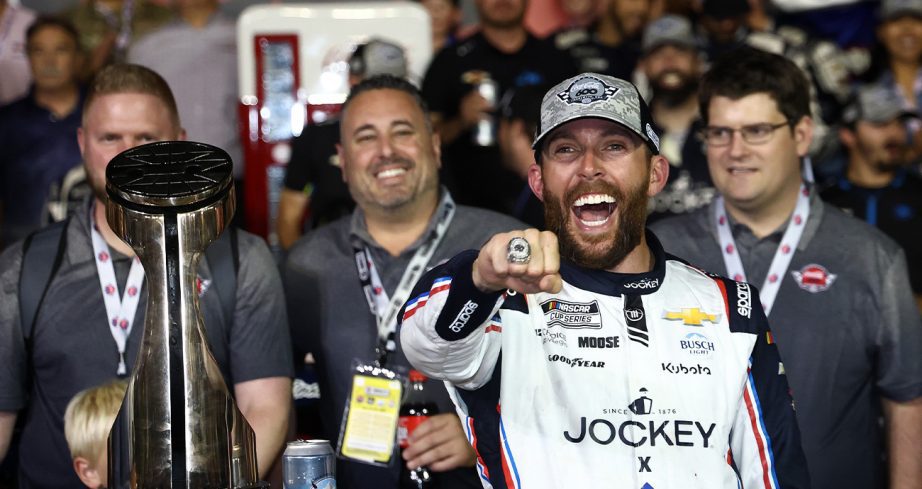 Ross Chastain celebrates in Victory Lane at Charlotte Motor Speedway.