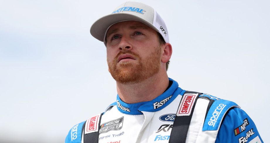 Chris Buescher looks on.