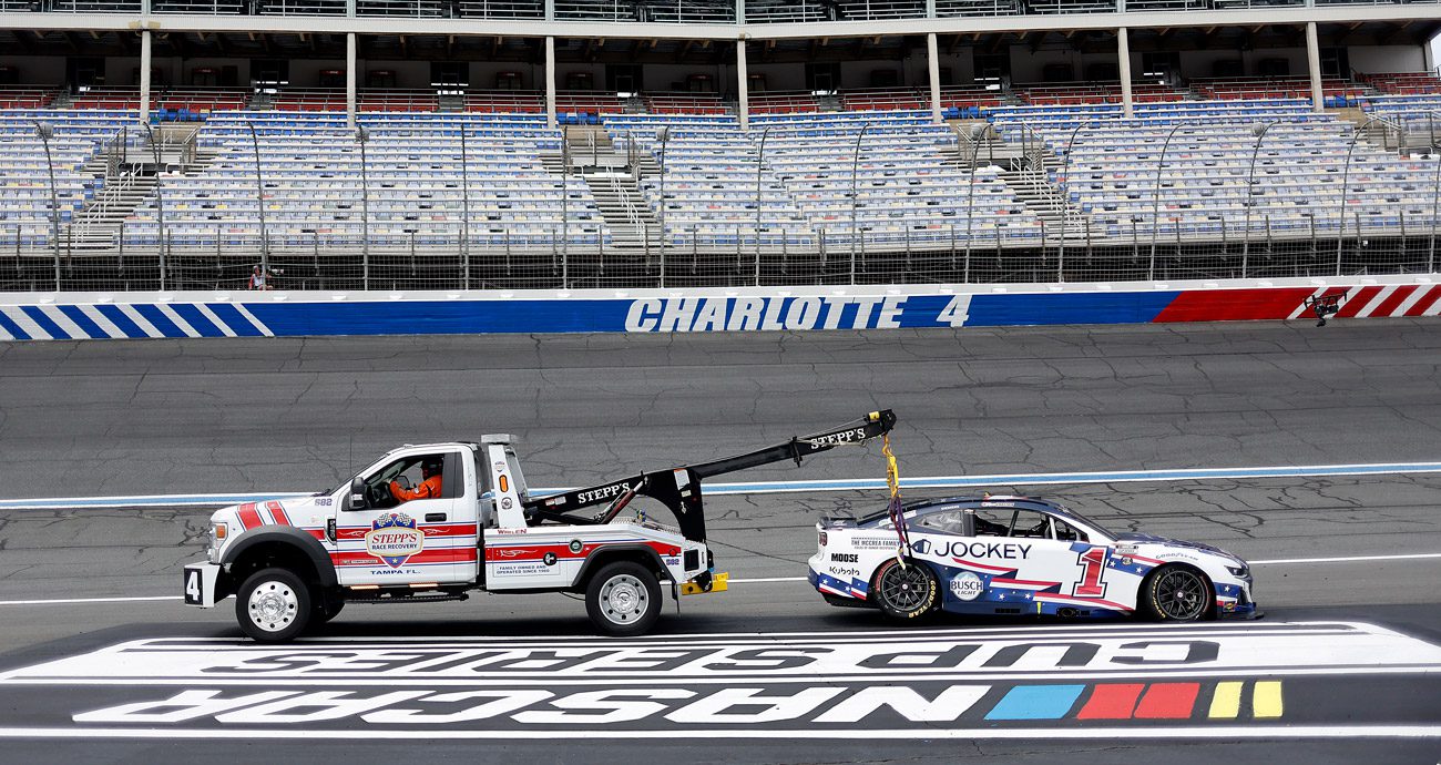 Ross Chastain's car is towed back to the Charlotte garage.