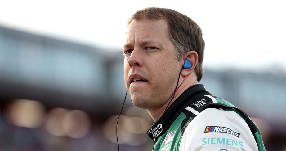 Brad Keselowski looks on.