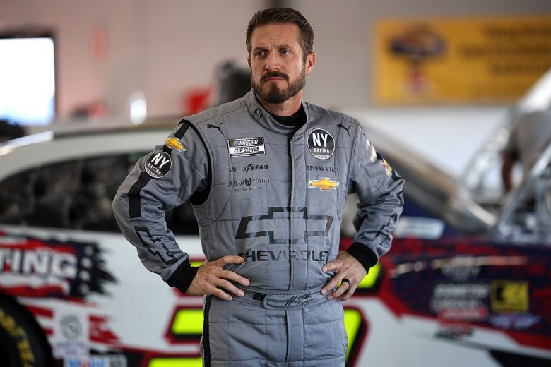 JJ Yeley looks on.