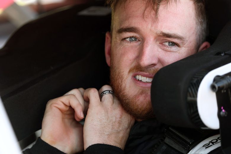 Ty Dillon looks on.