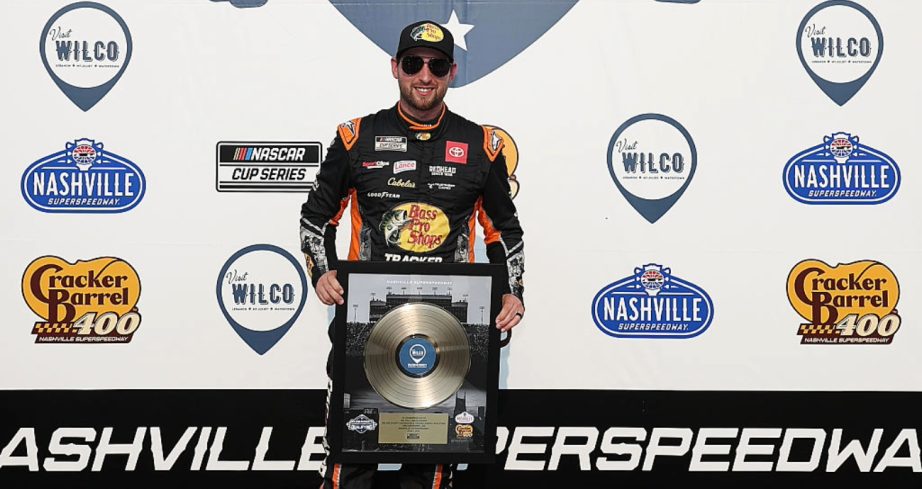 Chase Briscoe celebrates after winning the pole at Nashville.