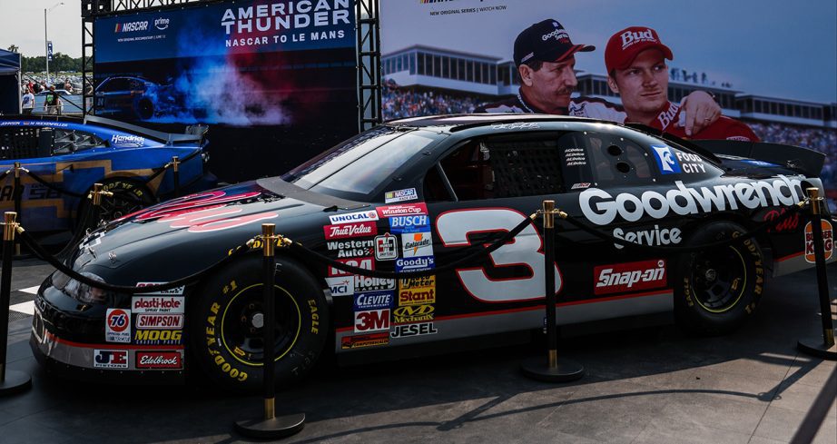 a dale earnhardt car sits in the prime video section of the fan zone at nashville superspeedway