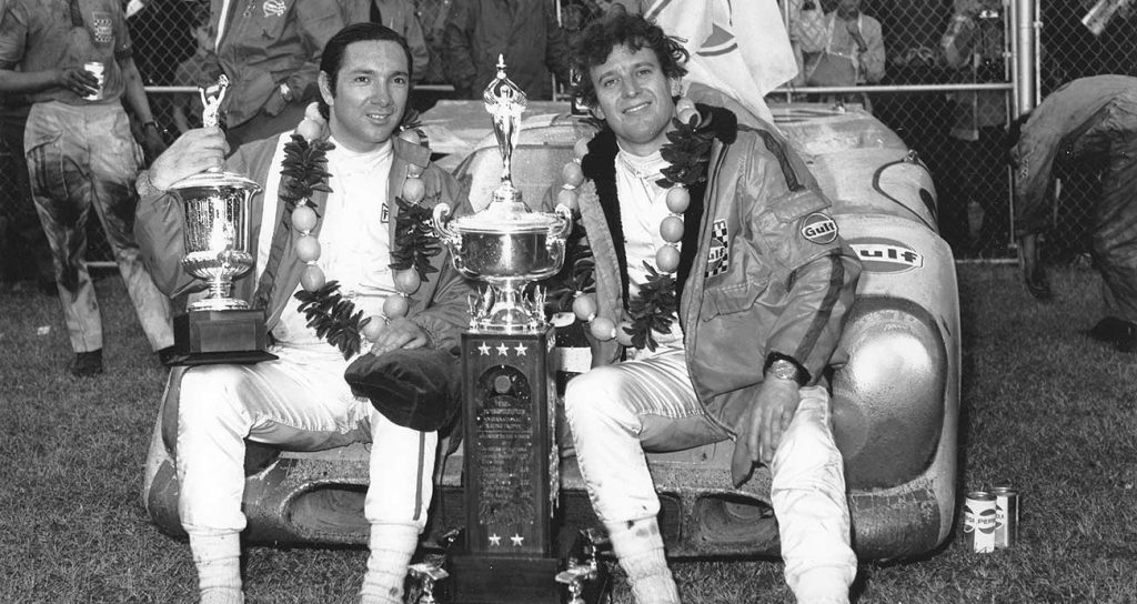 Mexico's Pedro Rodriguez (L) and Jackie Oliver of Great Britain in Victory Lane after driving John Wyer's Gulf Porsche 917K to victory in the 24 Hours of Daytona