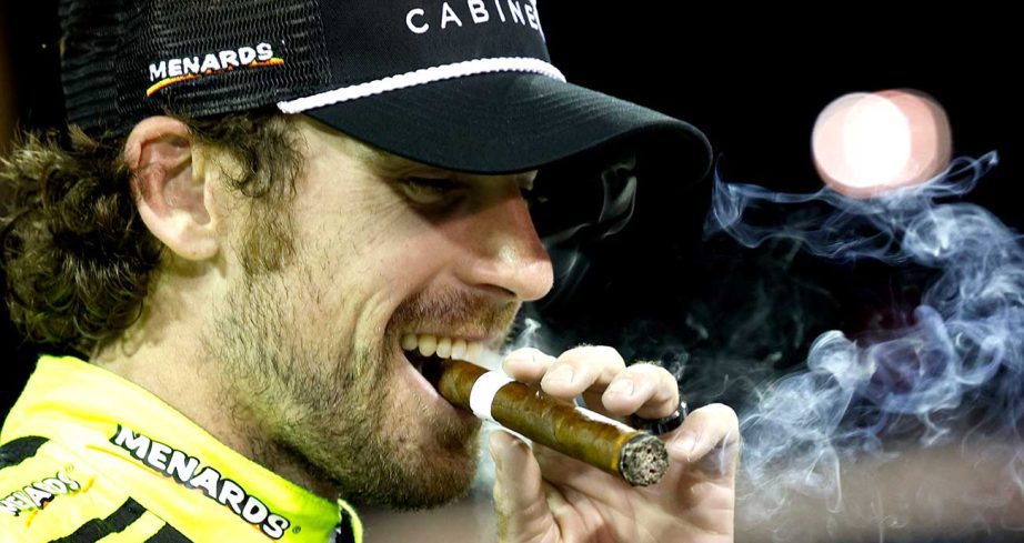 Ryan Blaney celebrates with a cigar in Victory Lane at Nashville Superspeedway