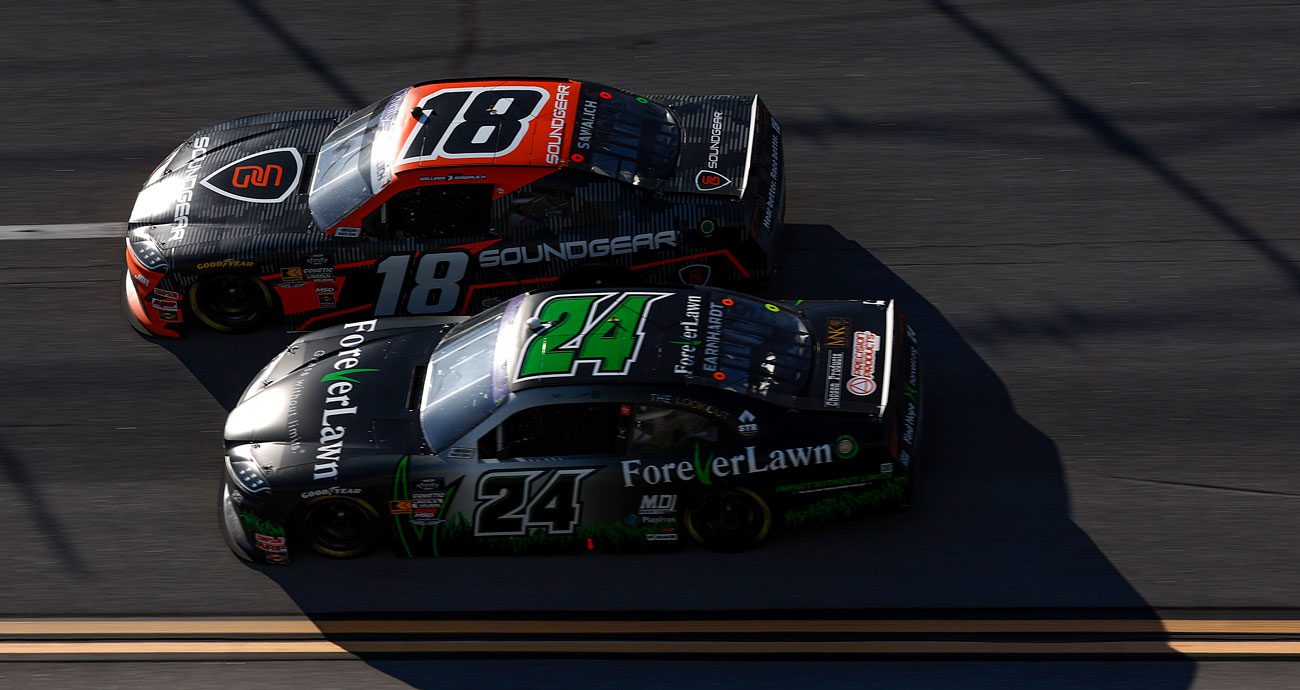 William Sawalich, in the No. 18 Toyota, races next to Jeffrey Earnhardt in the No. 24 Toyota during a NASCAR Xfinity Series race at Talladega Superspeedway.
