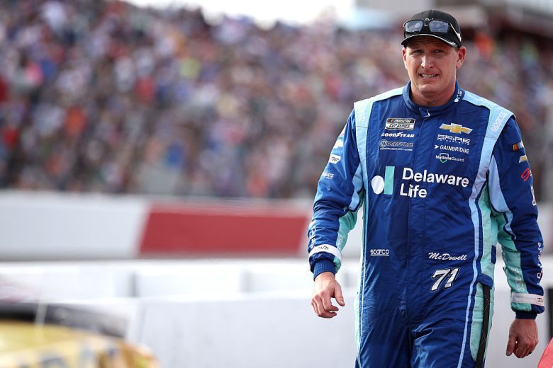 Michael McDowell looks on.