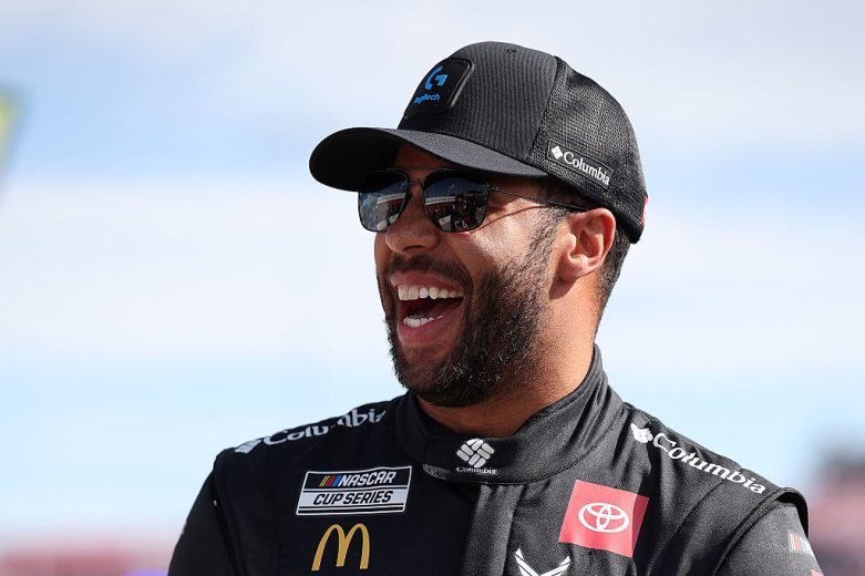 Bubba Wallace looks on.