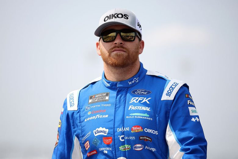 Chris Buescher looks on.