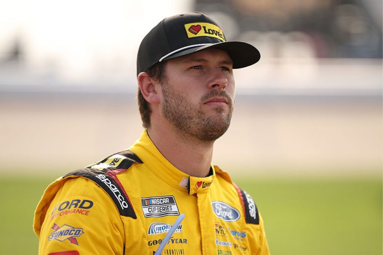 Todd Gilliland looks on.