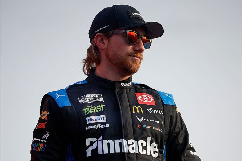 Tyler Reddick looks on.