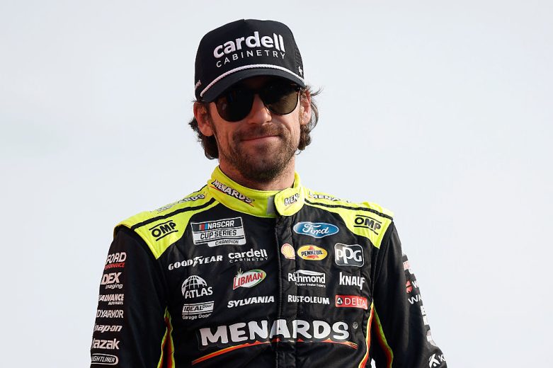 Ryan Blaney looks on.