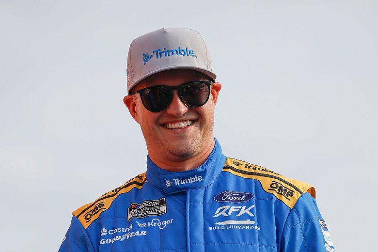 Ryan Preece looks on.
