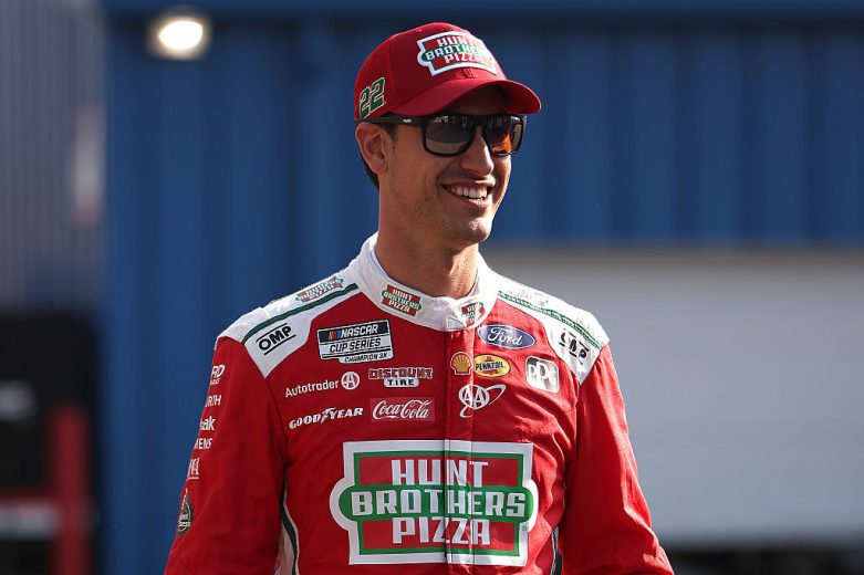 Joey Logano looks on at Michigan.
