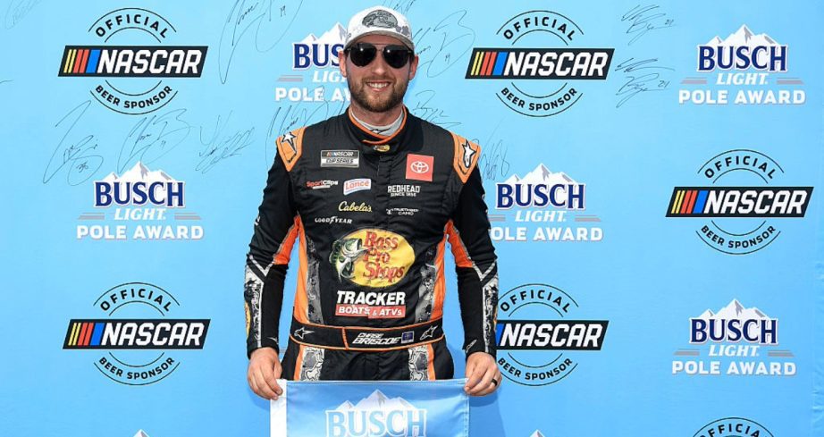 Chase Briscoe celebrates after winning the pole at Michigan.