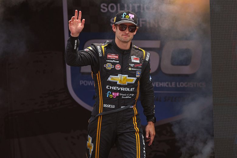 Connor Mosack waves to fans at Michigan.