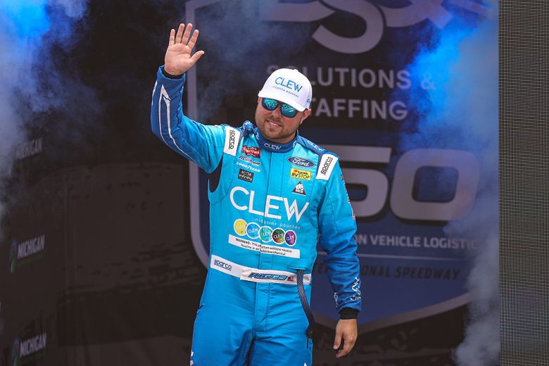 Layne Riggs waves to fans at Michigan.