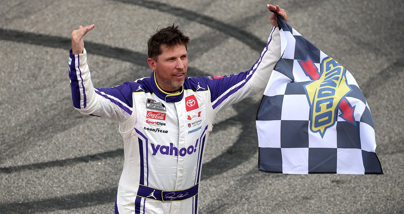 denny hamlin celebrates his nascar cup series win at michigan