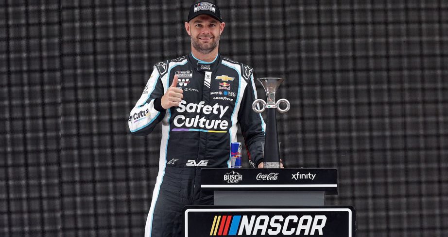 Shane van Gisbergen poses for a photo in Victory Lane following his NASCAR Cup Series win at Autodromo Hermanos Rodriguez.