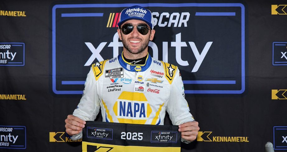 Chase Elliott celebrates after winning the pole at Pocono.