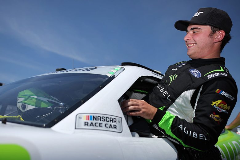 Sam Mayer enters his car at Pocono.