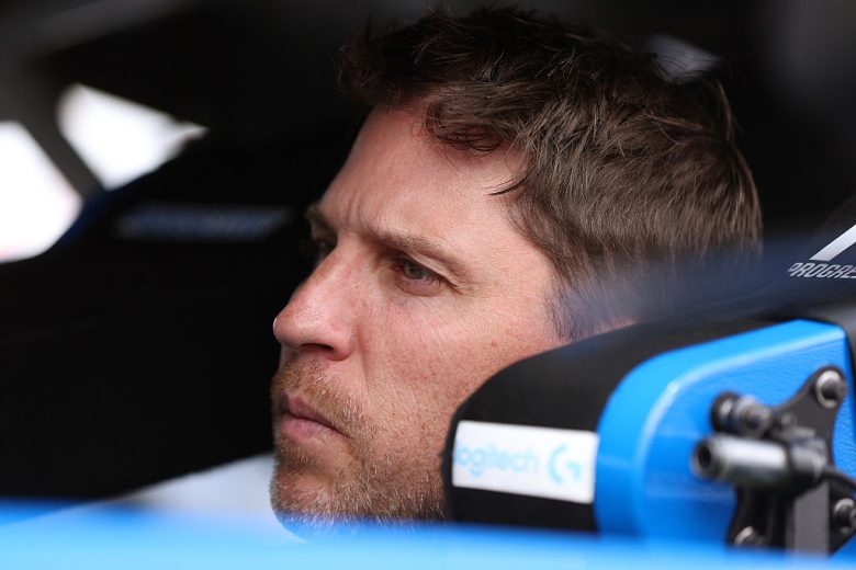 Denny Hamlin sits in his car at Pocono.