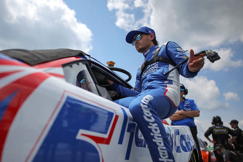 Kyle Larson enters his car at Pocono.