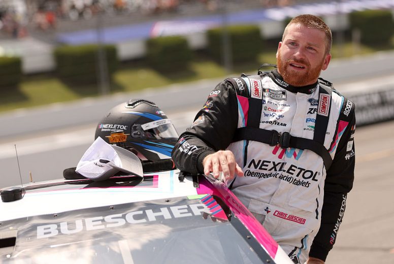 Chris Buescher enters his car at Pocono.