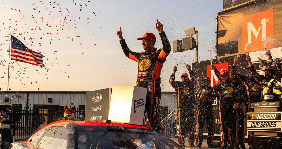 Chase Briscoe celebrates in Victory Lane after Pocono win.
