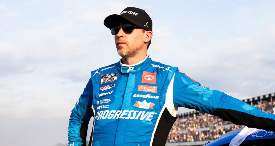 Denny Hamlin stands next to his car after finishing second at Pocono.
