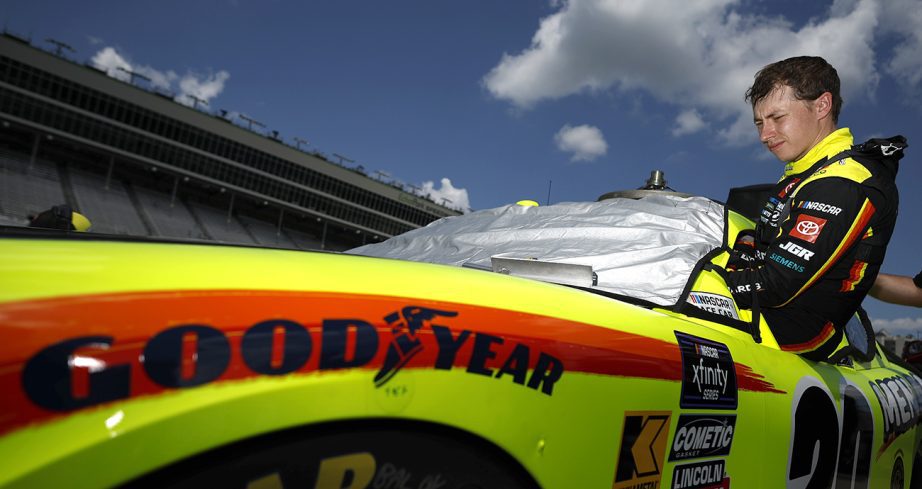 Brandon Jones climbs into No. 20 Toyota.