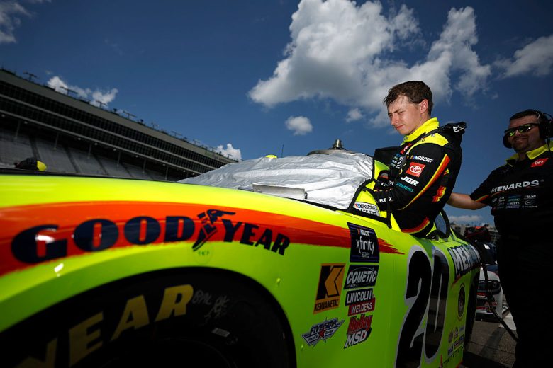Brandon Jones enters his car at EchoPark Speedway.