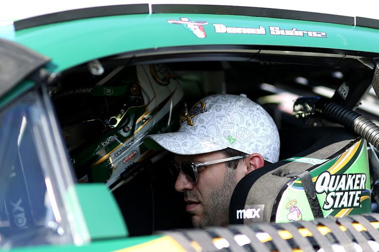 Daniel Suárez sits in his car at EchoPark Speedway.