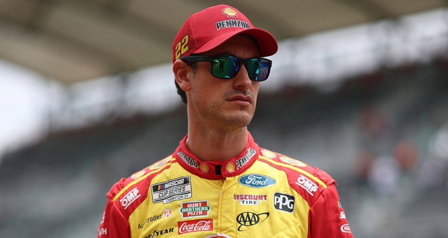 Joey Logano looks on.
