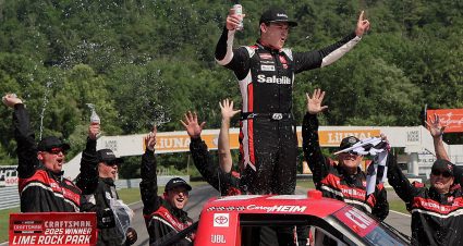 Corey Heim celebrates a Truck Series win at Lime Rock Park.