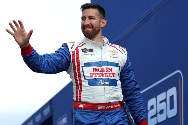 CJ McLaughlin waves to fans at EchoPark Speedway.