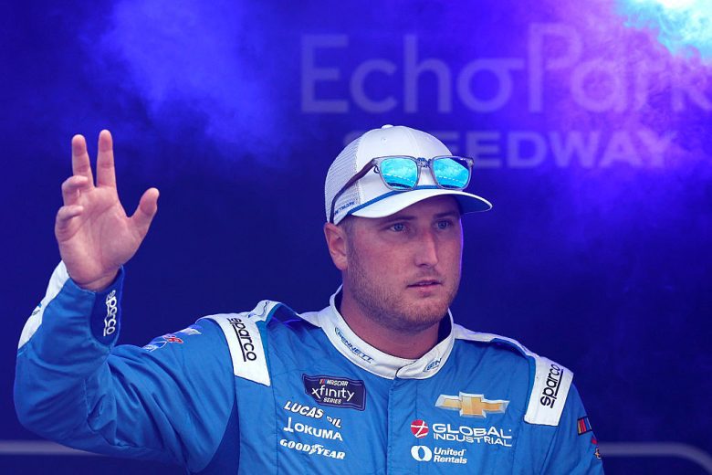 Austin Hill waves to fans at EchoPark Speedway.