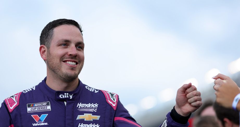 Alex Bowman fist-bumps a fan at EchoPark Speedway.