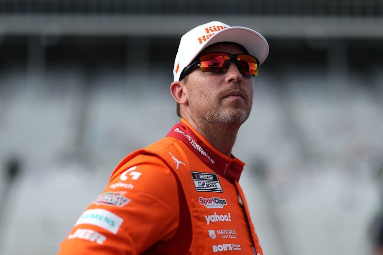 Denny Hamlin looks on.