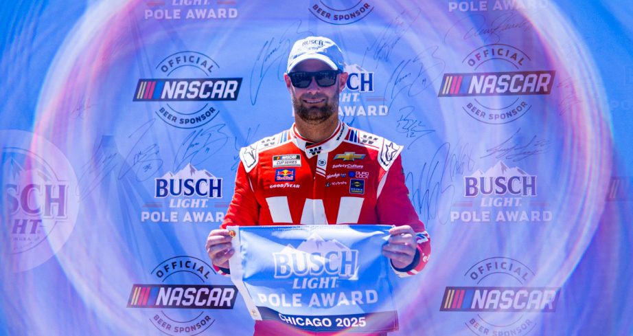 Shane van Gisbergen celebrates after winning the pole at Chicago.