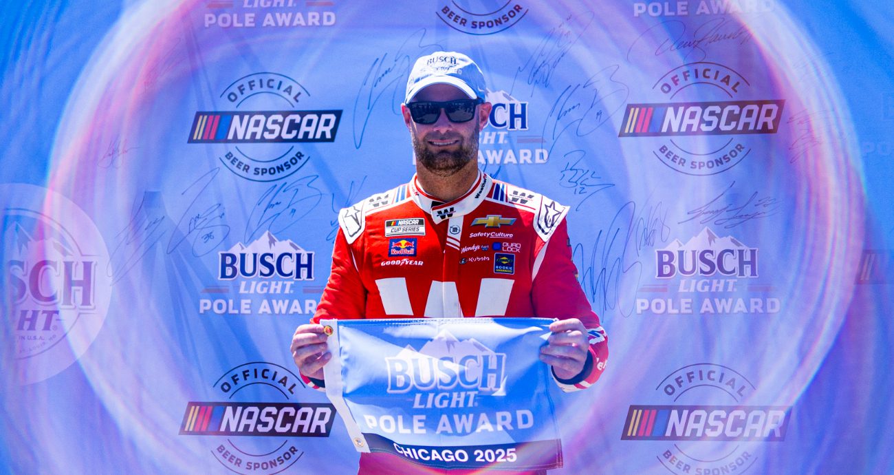 Shane van Gisbergen celebrates after winning the pole at Chicago.
