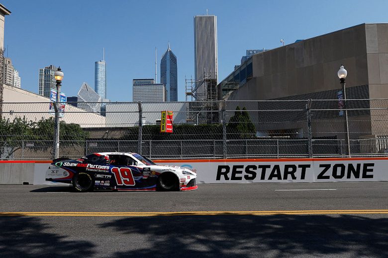 Jack Perkins drives at Chicago.