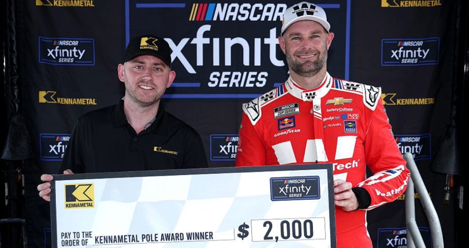 Shane van Gisbergen celebrates after winning the pole at Chicago.