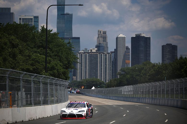 Jack Perkins drives at Chicago.