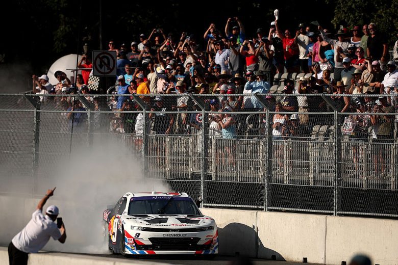 Shane van Gisbergen does a burnout after winning at Chicago.