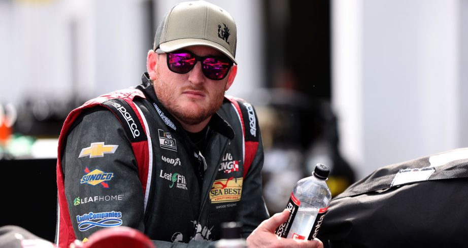 Ty Dillon looks on.